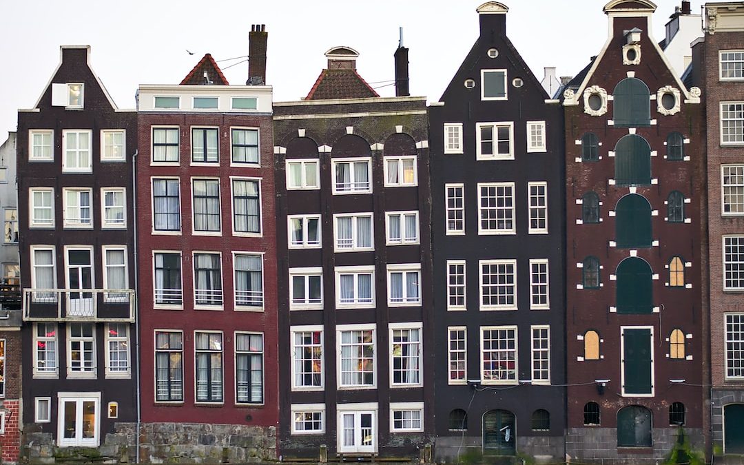 assorted-color houses under white sky