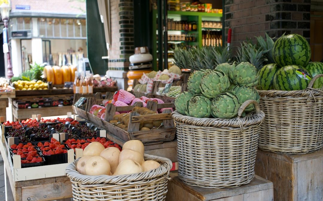 a market with baskets of fruit