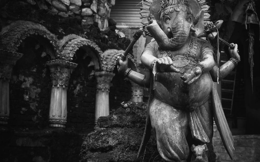 grayscale photo of angel statue