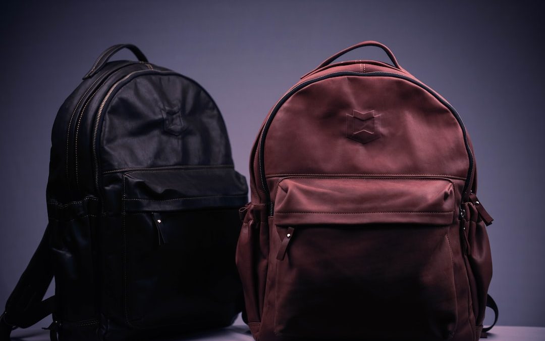 black and brown backpack on white textile