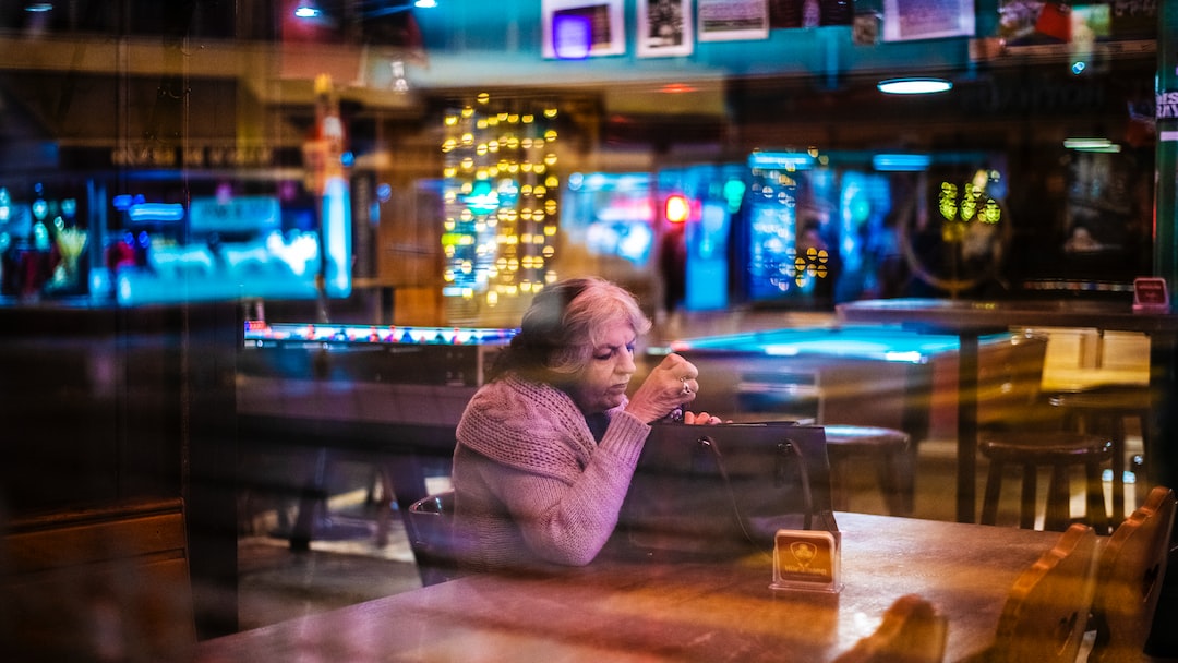 woman sitting at the table inside room