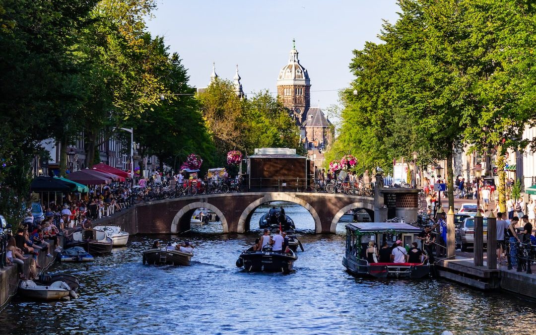 people riding on boat on river during daytime