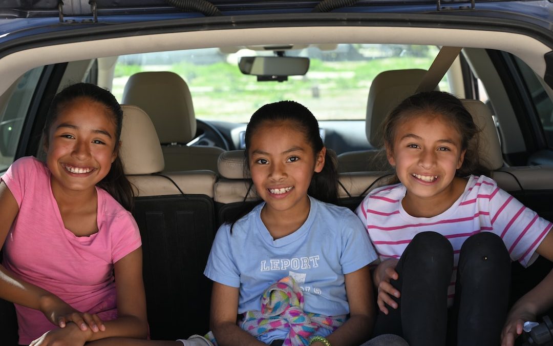 three girls in vehicle