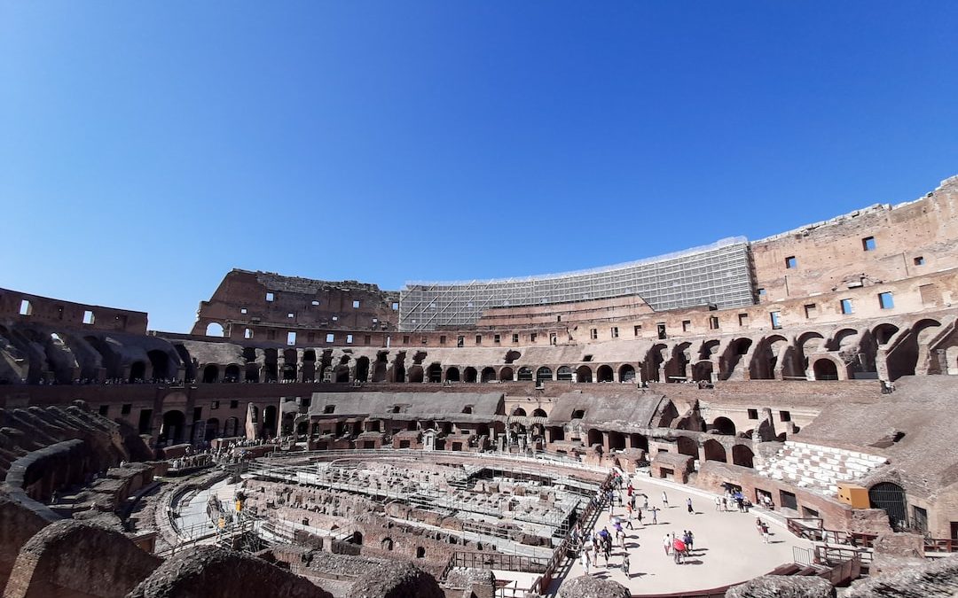 the inside of an ancient building with a sky background