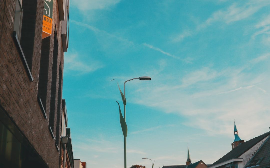 a street light on a city street next to a building