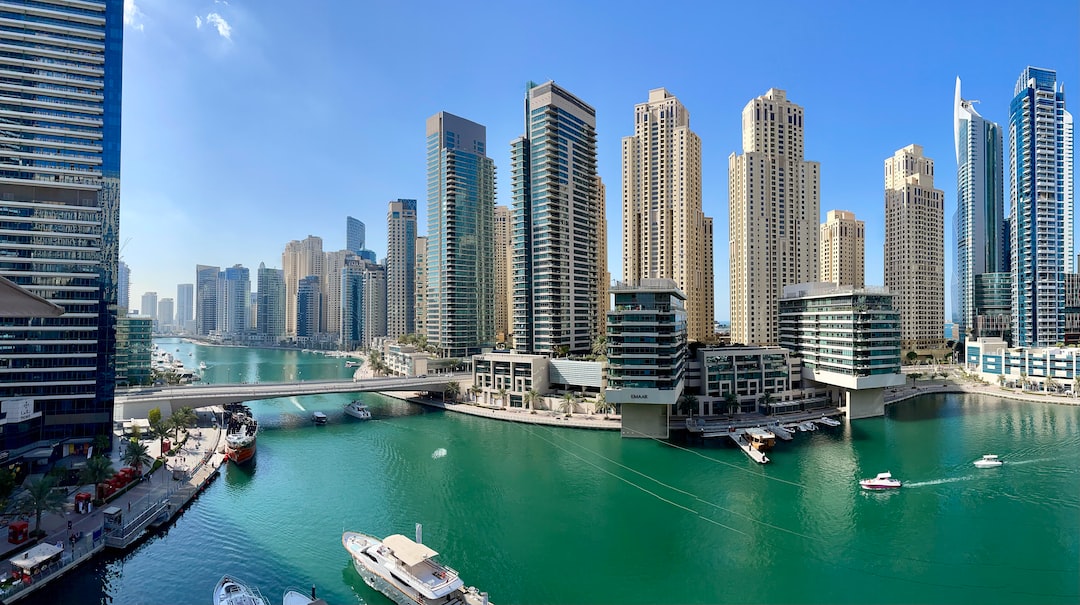 high rise buildings near body of water during daytime