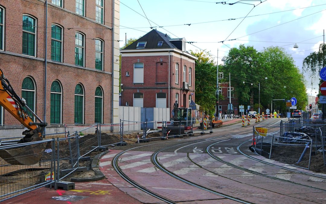 a train track with buildings on the side