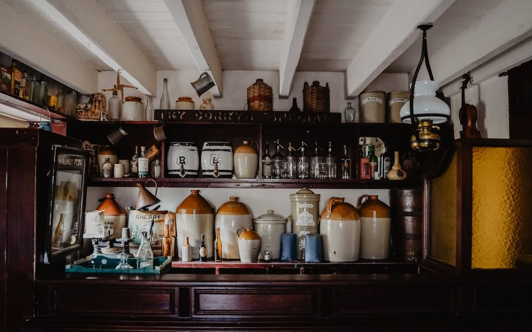 white ceramic jars on brown wooden shelf