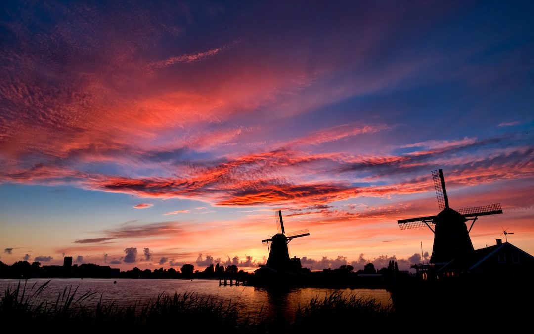 silhouette of two windmills