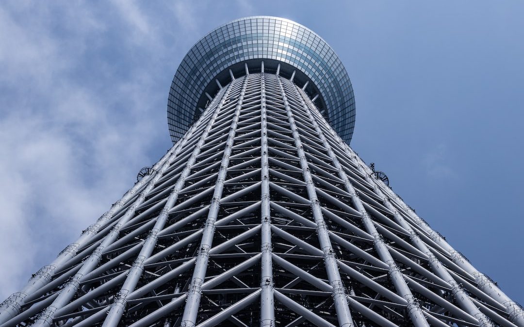 grey tower with round top under grey cloudy sky