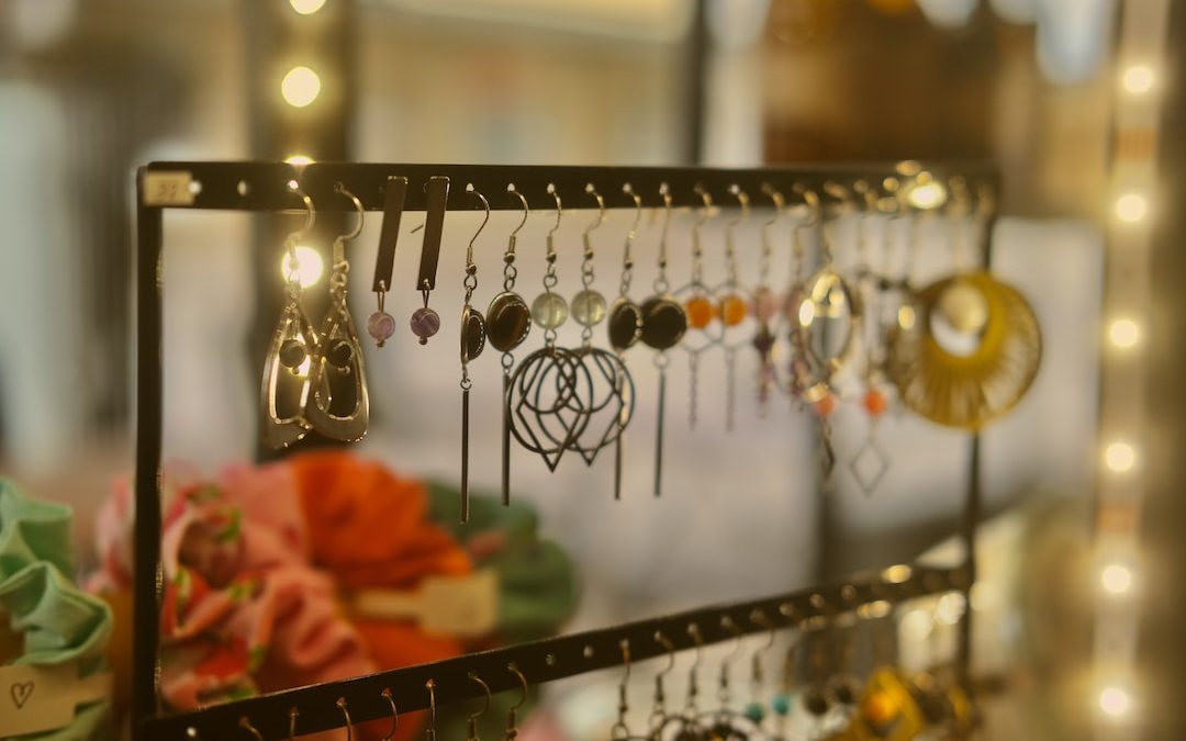 a rack with earrings hanging from it's sides