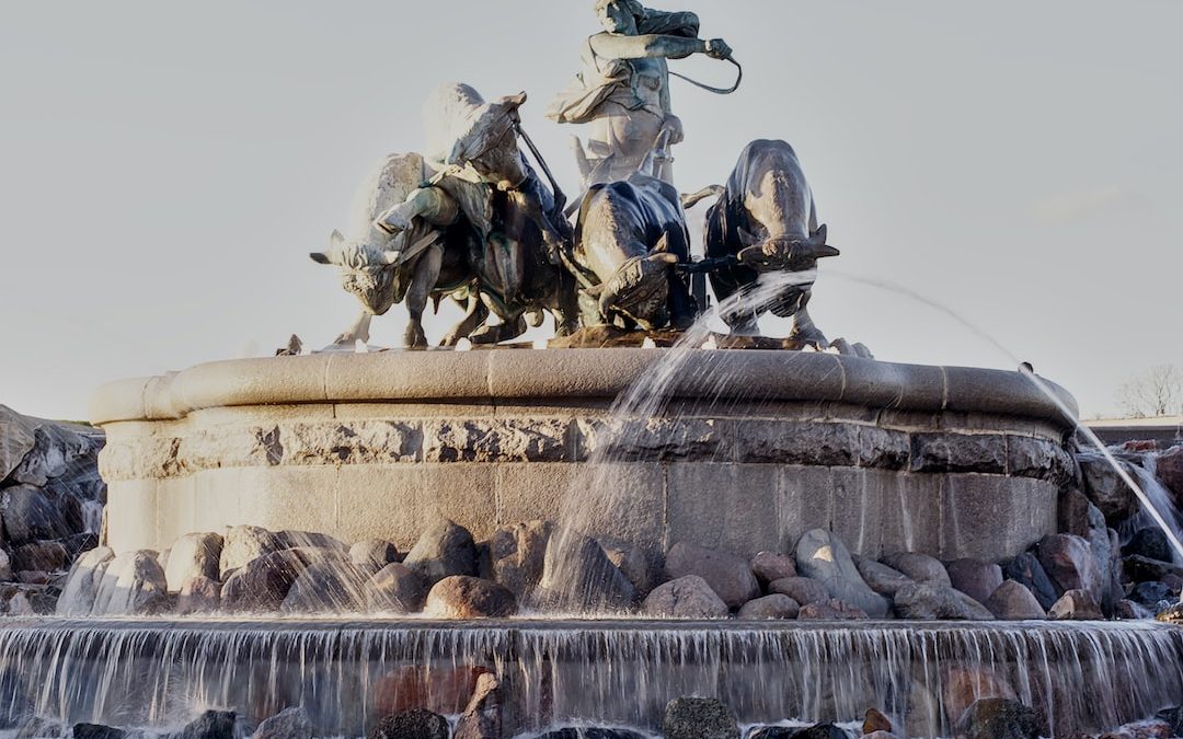 a fountain with a statue of a man on a horse