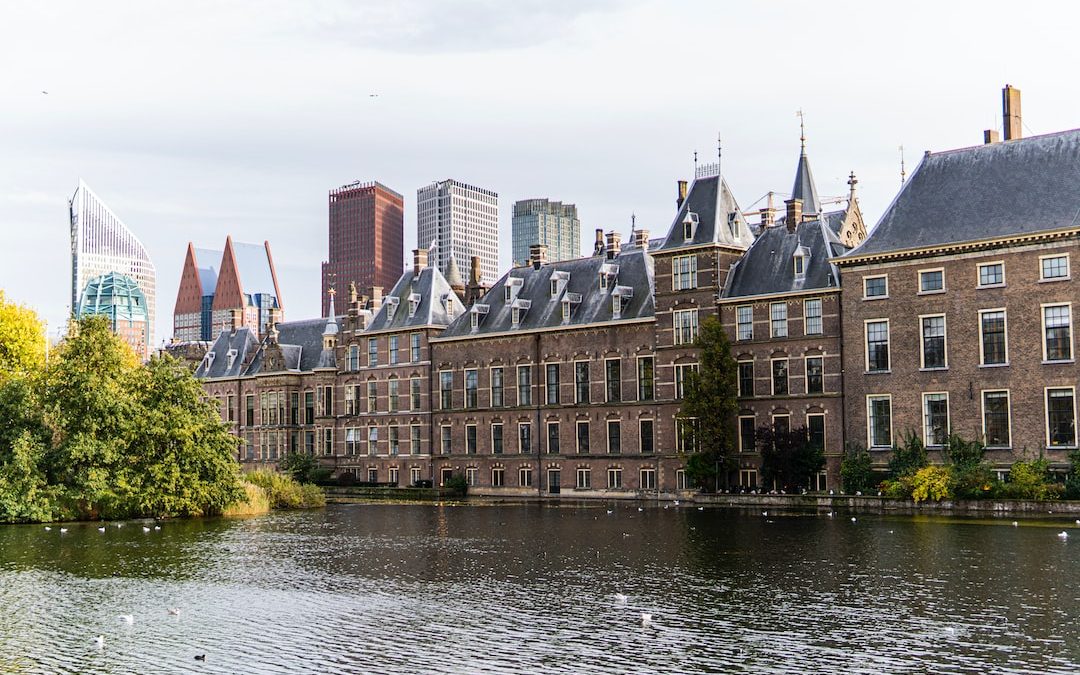 a group of buildings next to a body of water