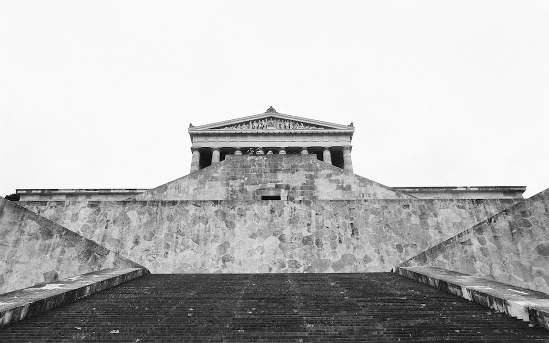 grayscale photography of concrete stairs near musuem