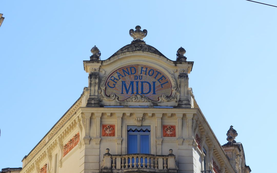white and brown concrete building under blue sky during daytime