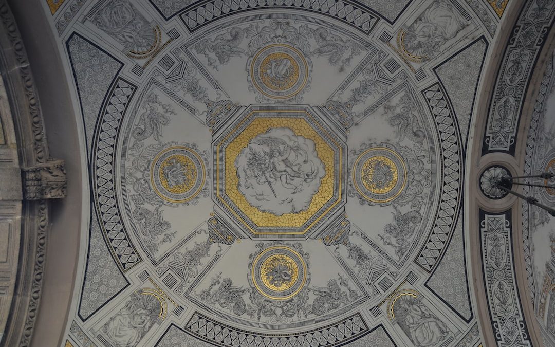 photo of white, gray, and yellow building ceiling