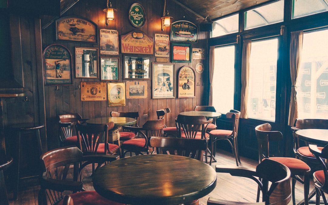 round wooden cafeteria tables and chairs inside room