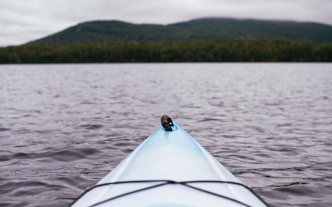 point of view photography of kayak on lake