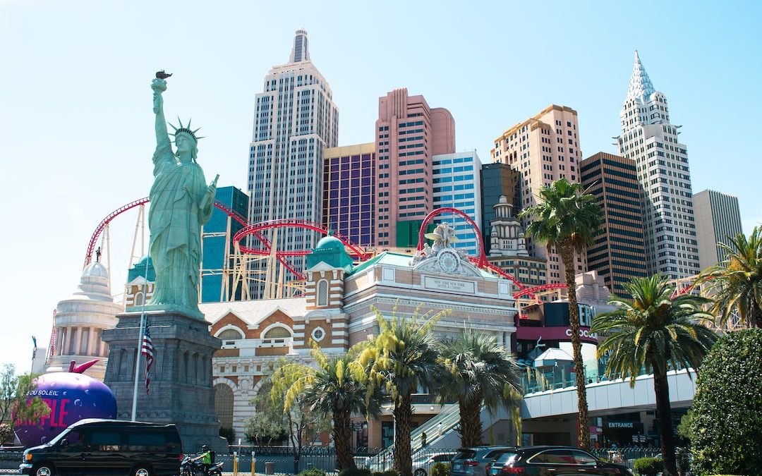 a statue in front of New York-New York Hotel and Casino