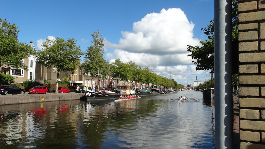 a body of water with boats and buildings along it