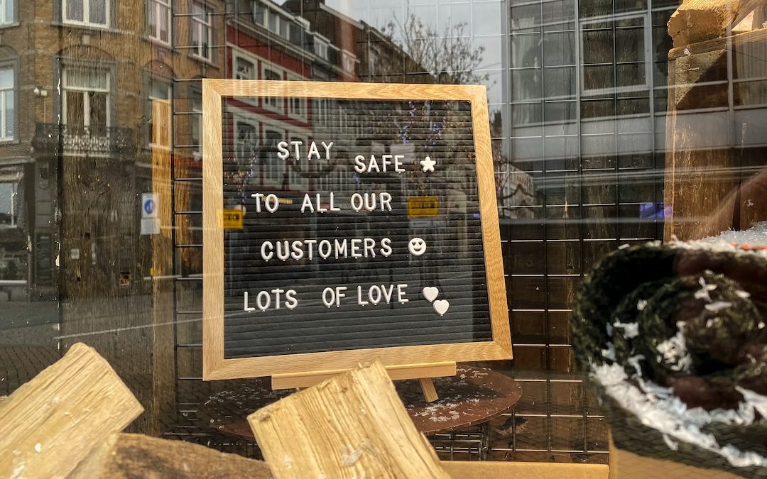 brown wooden signage on brown wooden plank