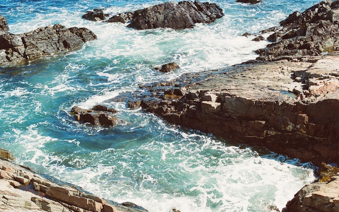 a view of a body of water near some rocks