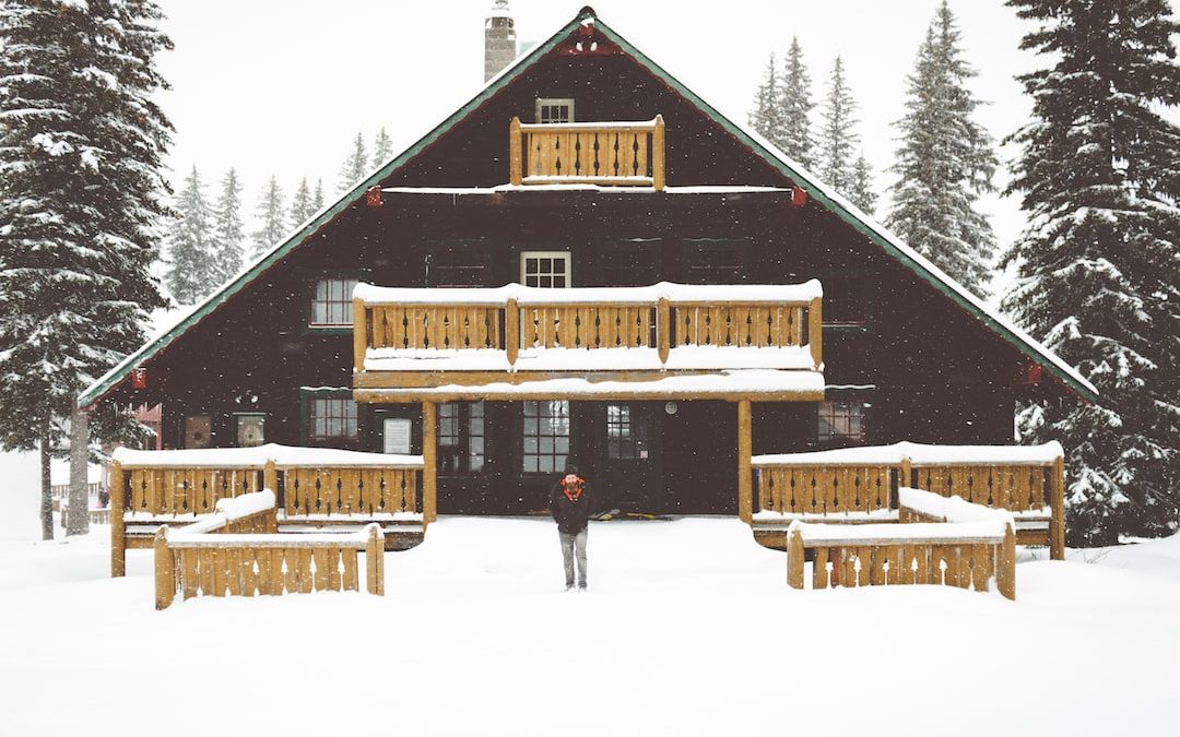 people standing beside house