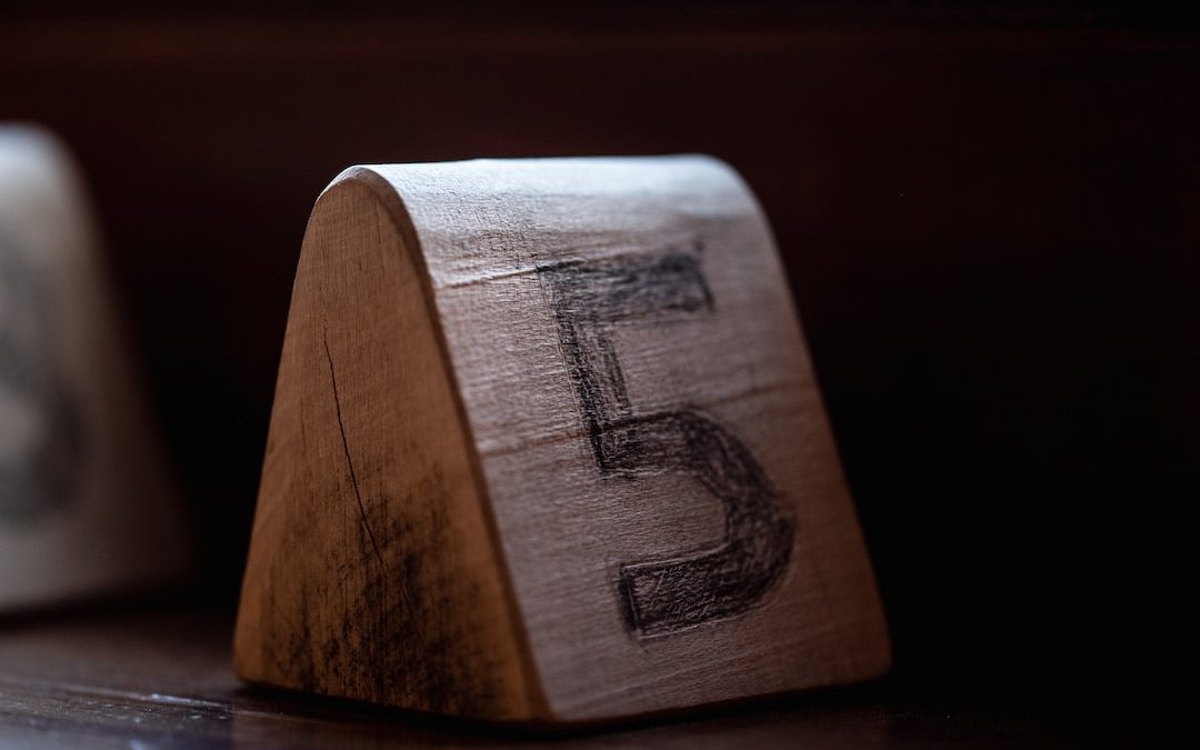 a close up of a wooden block on a table