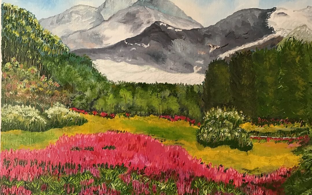 pink flower field near mountain during daytime