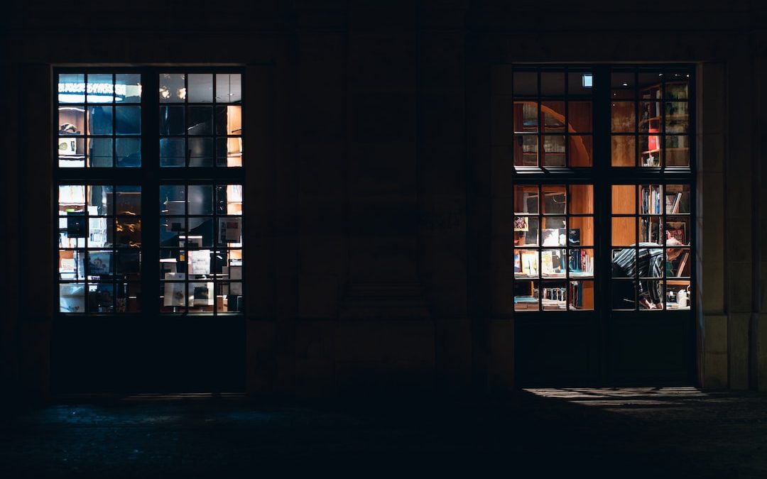 a building with windows and a chair outside