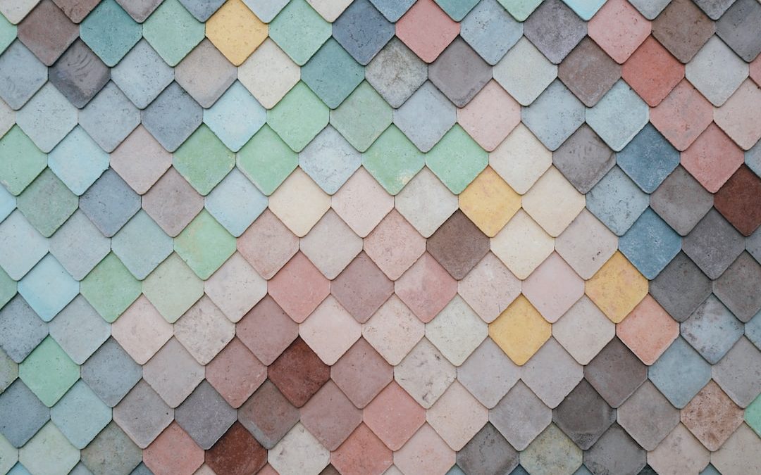 a multicolored tile wall with a pattern of small squares