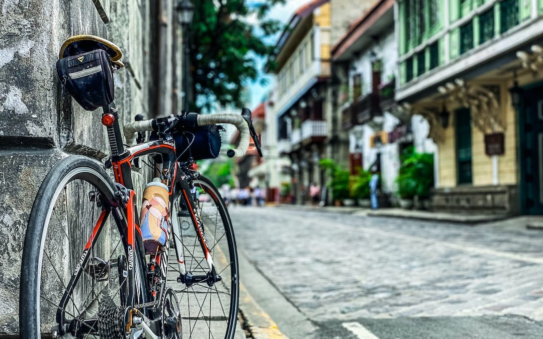 a bicycle parked on the side of a building