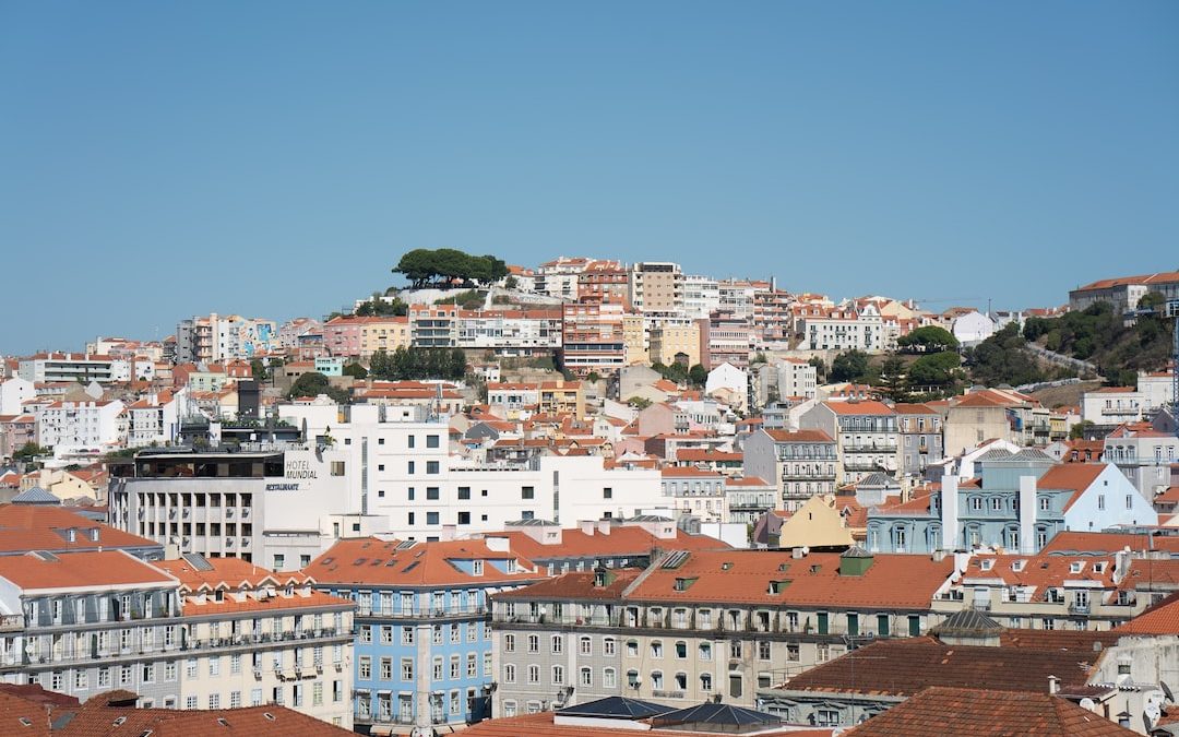 brown and white concrete buildings under blue sky during daytime