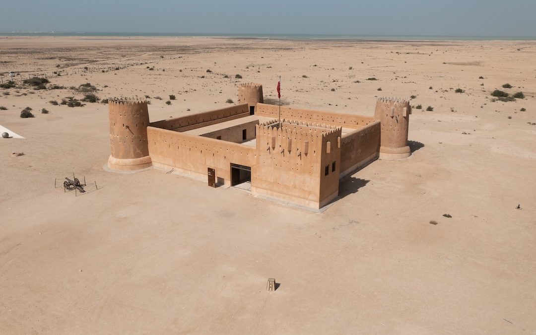 a building in the middle of a desert