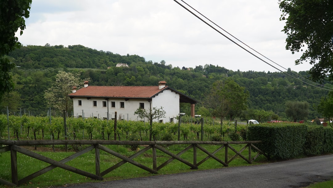 a white house sitting on the side of a road