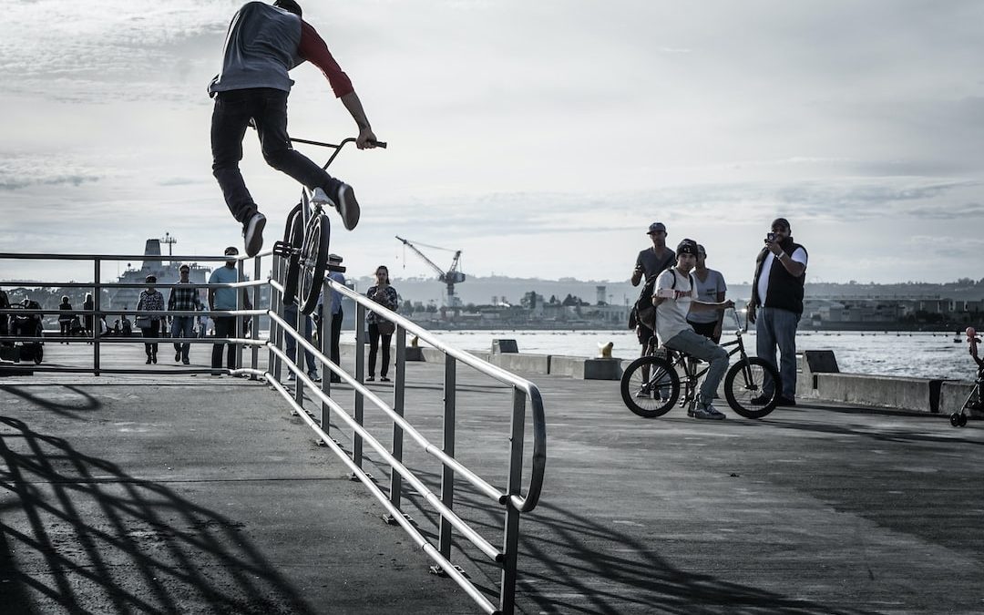 man doing tricks while riding on bike