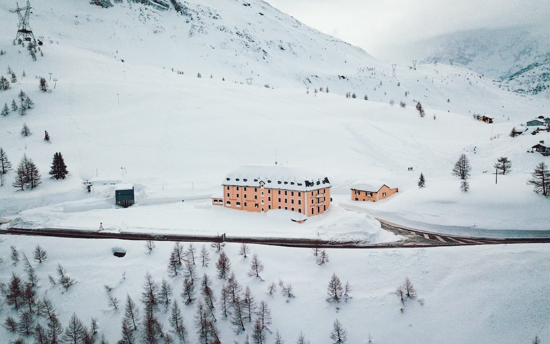 building on snowy mountain during daytime