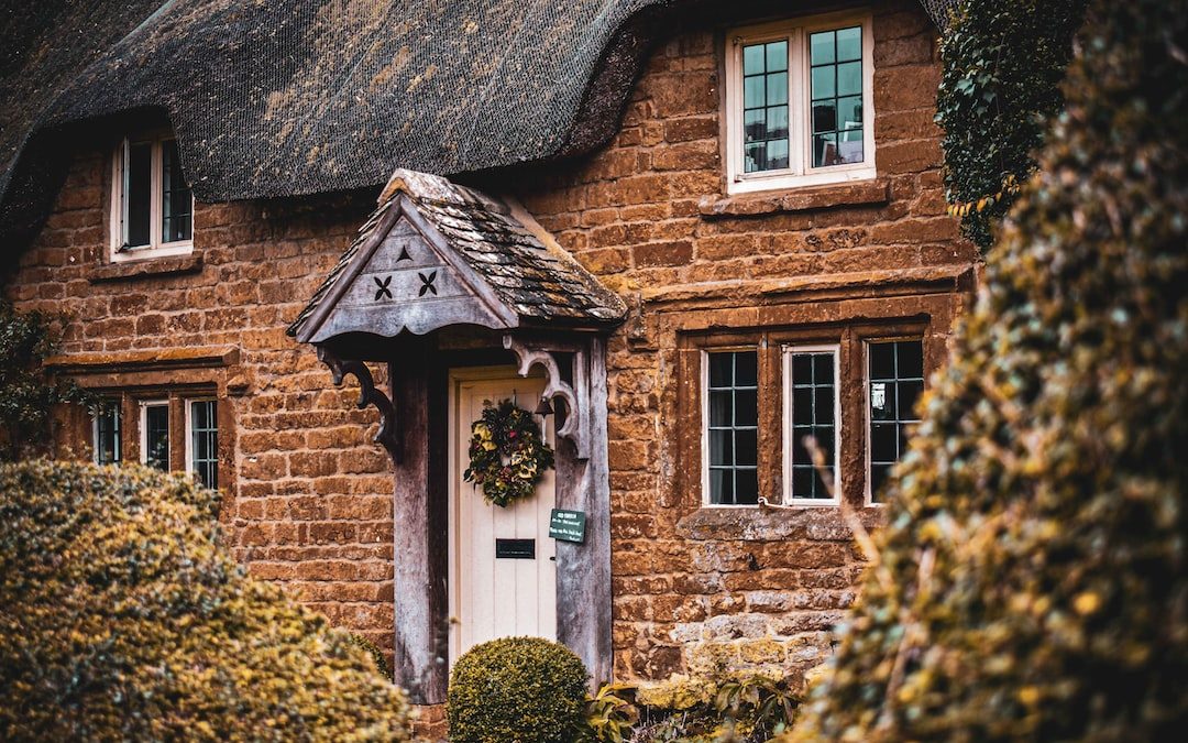 brown brick house with white wooden door