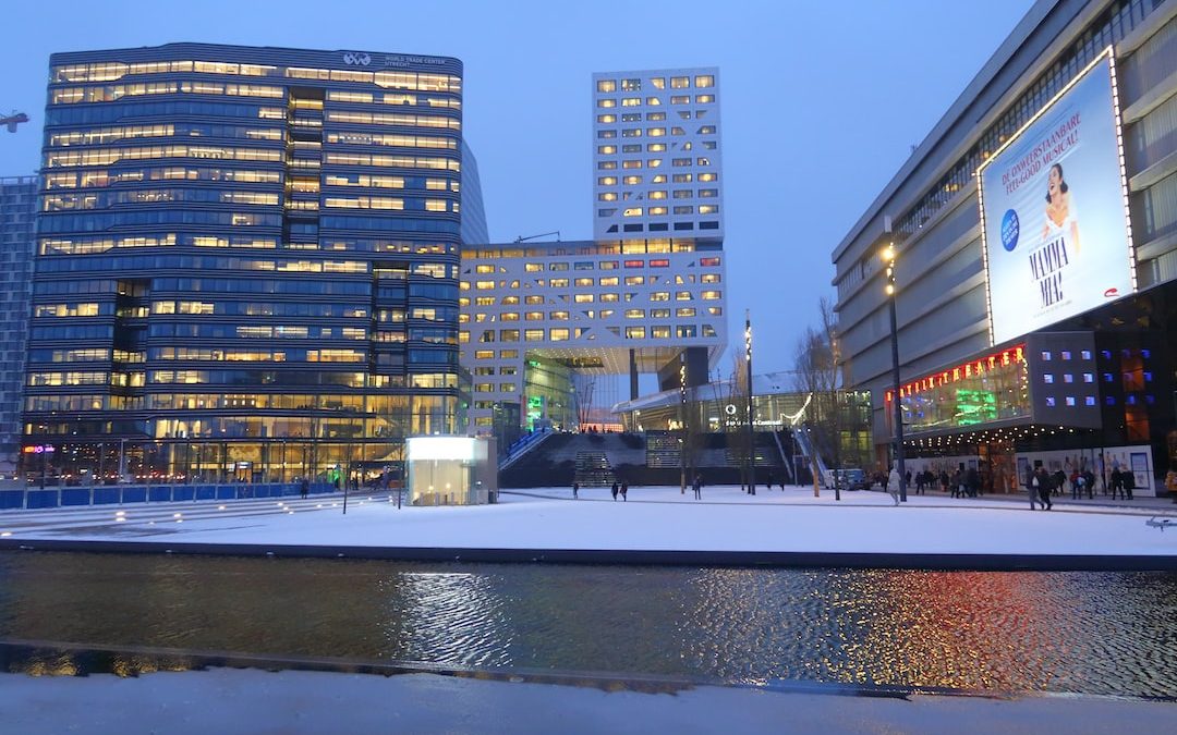 a couple of buildings that are next to a body of water