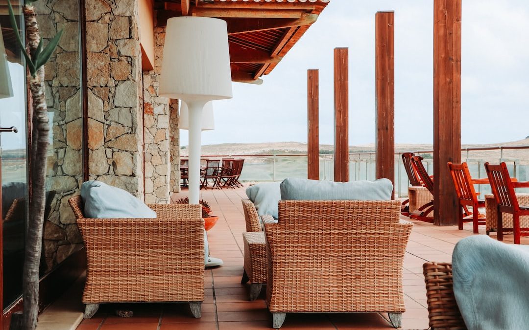 brown wicker chairs on porch during daytime