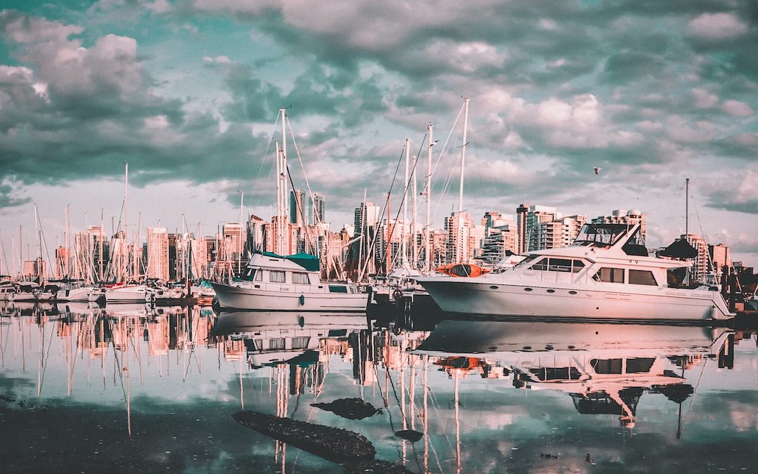 photo of sailing boats on body of water