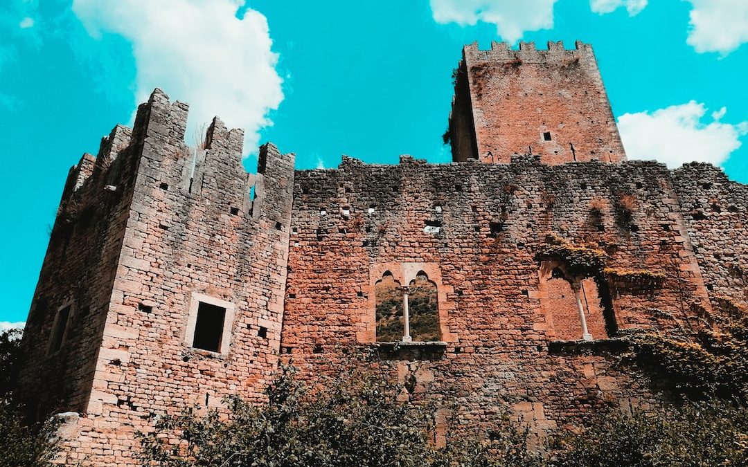 brown brick castle under blue sky