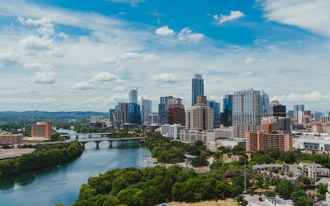 river near buildings during daytime