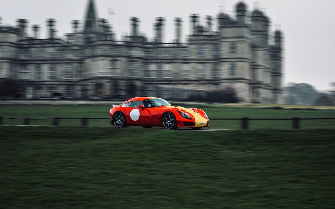 selective focus photography of red and yellow coupe