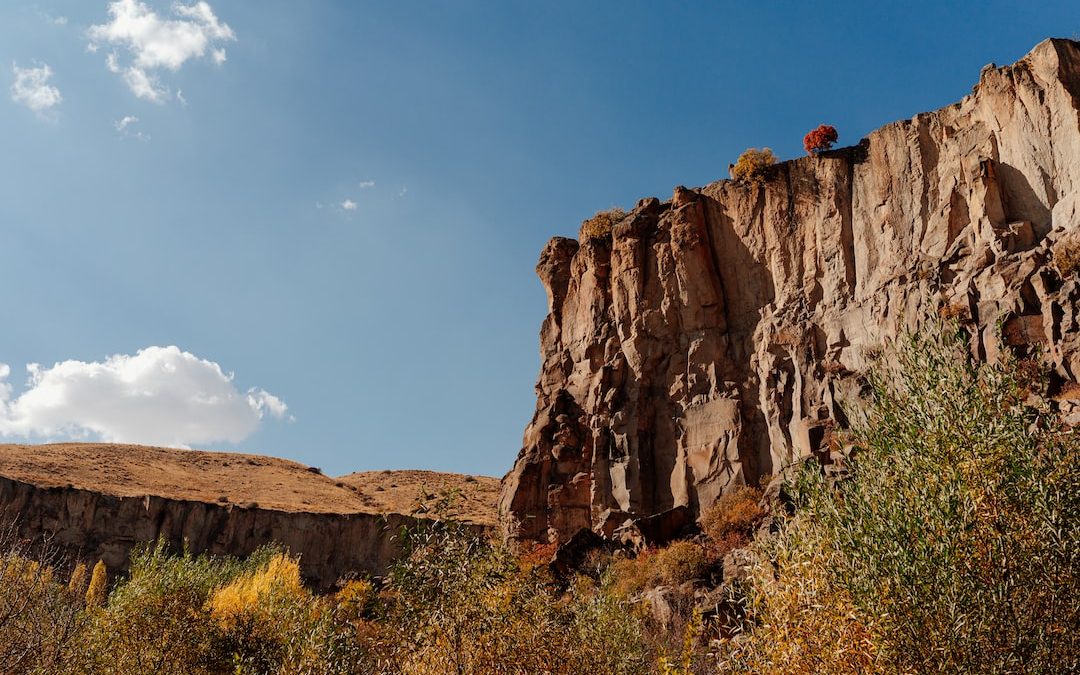 a person standing on a cliff