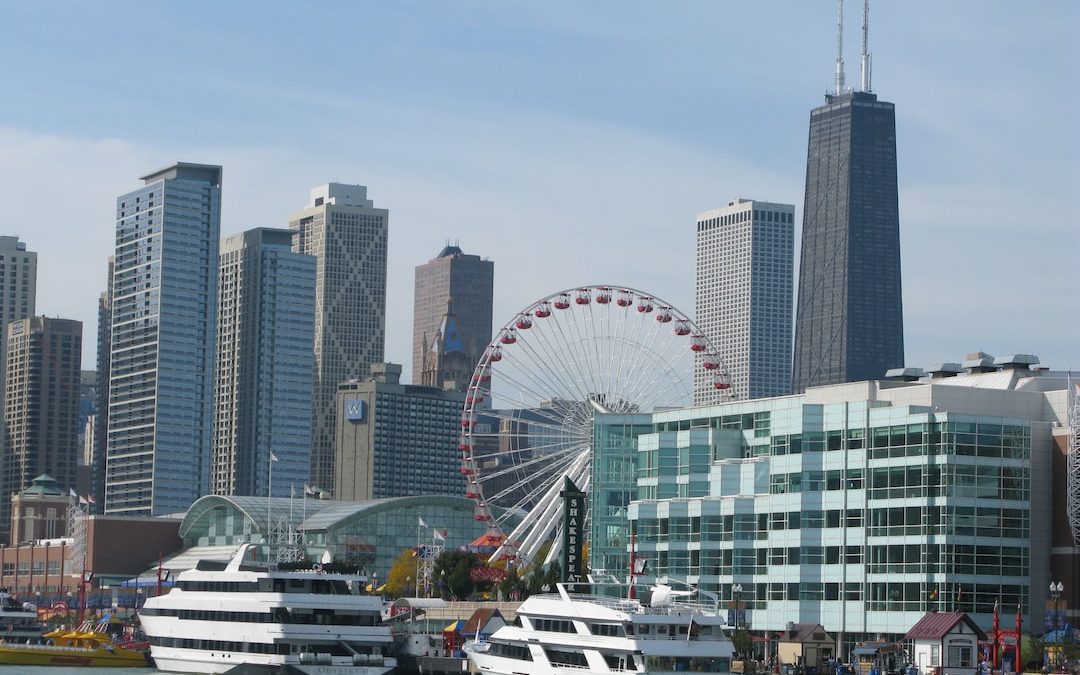 a city skyline with a ferris wheel in the foreground