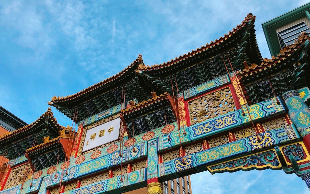 photo of teal and red temple gate