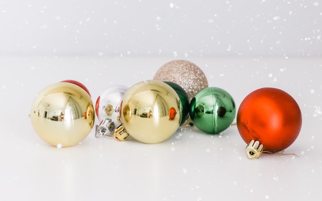 assorted-color baubles on white surface