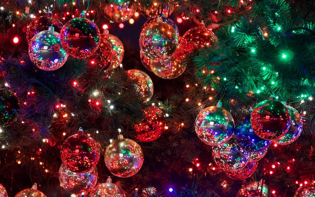 baubles on Christmas tree with turned-on lights