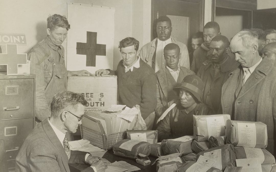 Red Cross food orders and free seed for quarter acre garden plots are given white and colored farmers by the Red Cross chapter at Cleveland, Mississippi.
